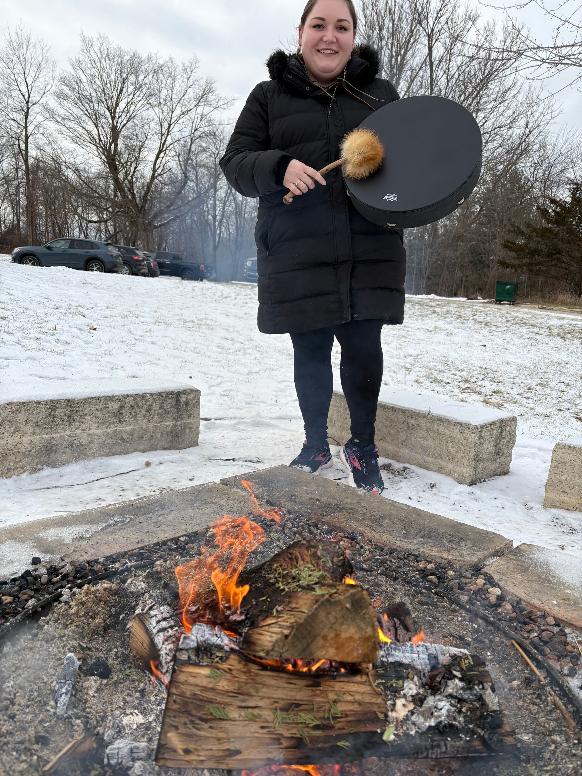 Laina with her drum at the 2025 yule celebration