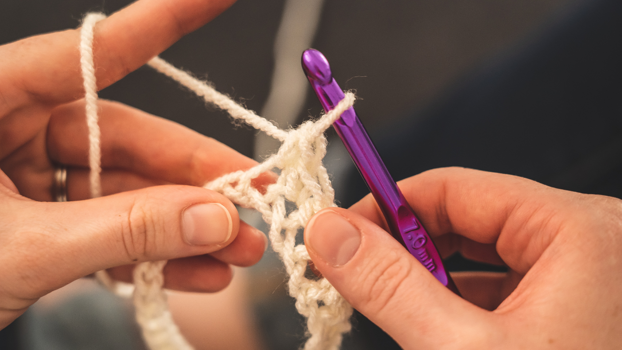 A person crocheting
