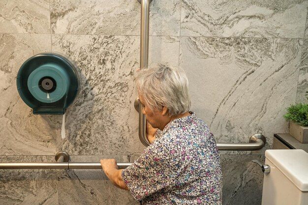 old lady woman patient use toilet bathroom handle security