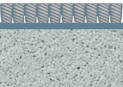 A close up of a carpet with a metal border.