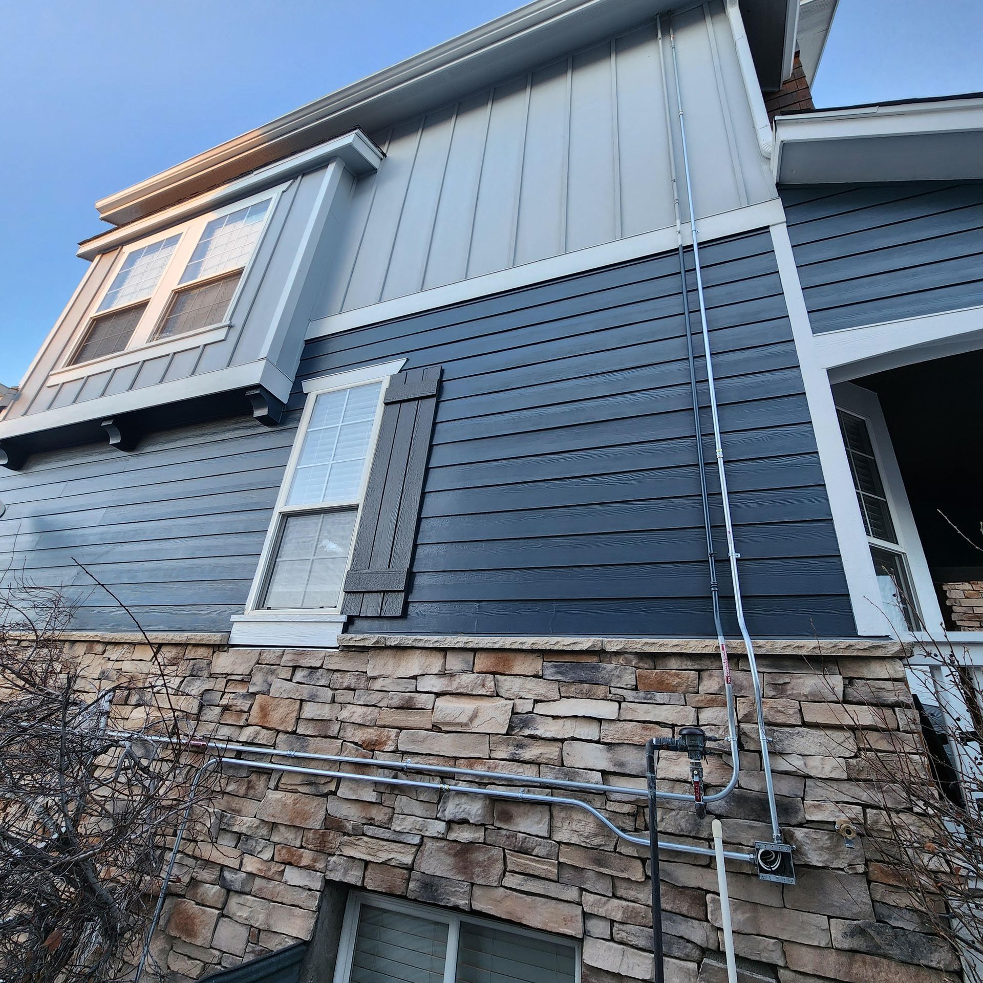 A house with a ladder attached to the side of it.
