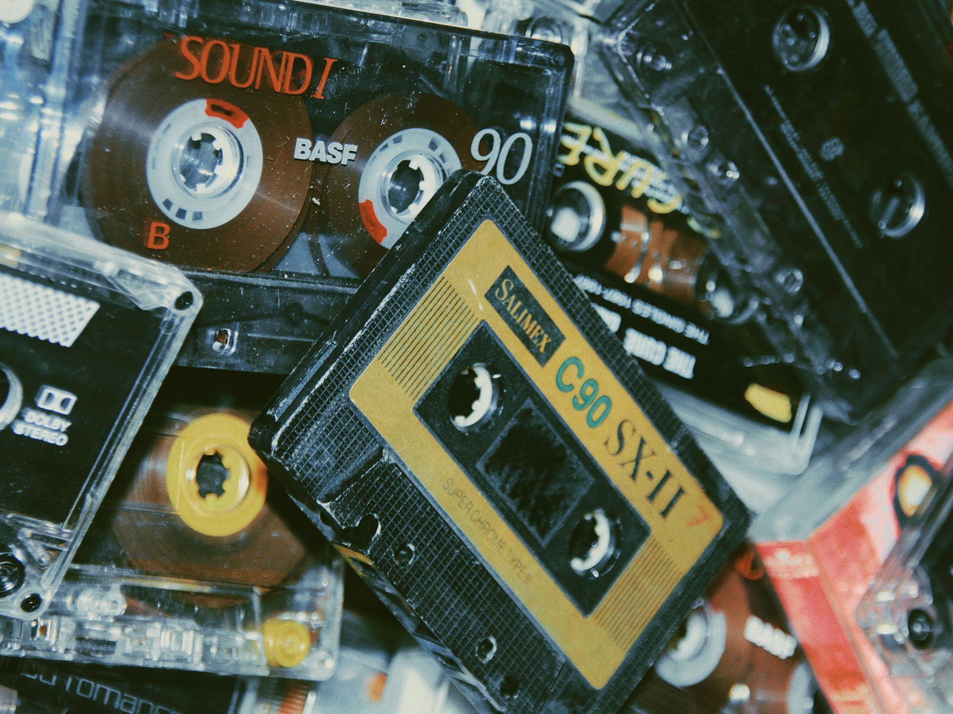 A pile of cassette tapes including one that says sound