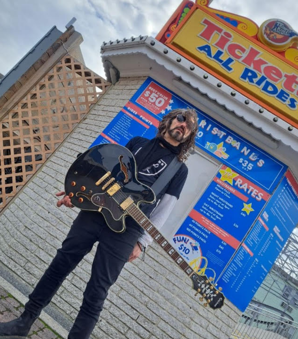 A woman is taking a selfie in a bathroom mirror.