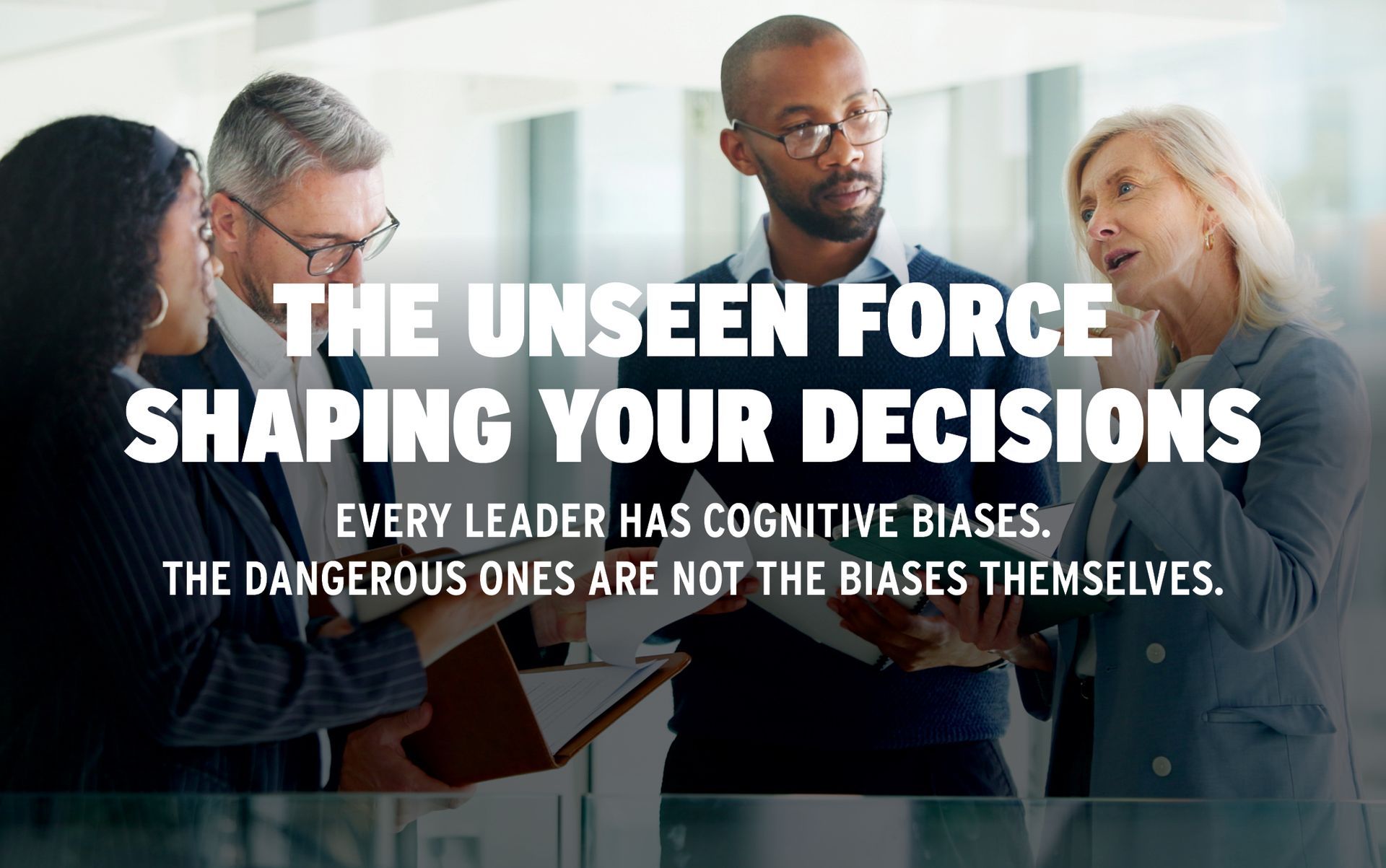 Team meeting in office with bold text overlay about cognitive biases shaping decisions