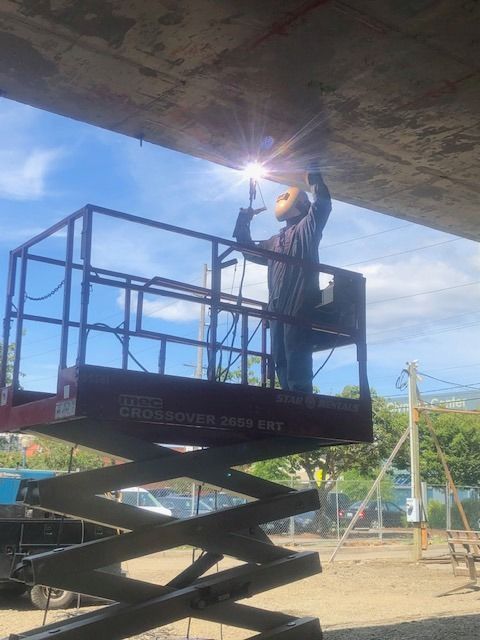Lift equipment positioned for structural repair work on commercial building