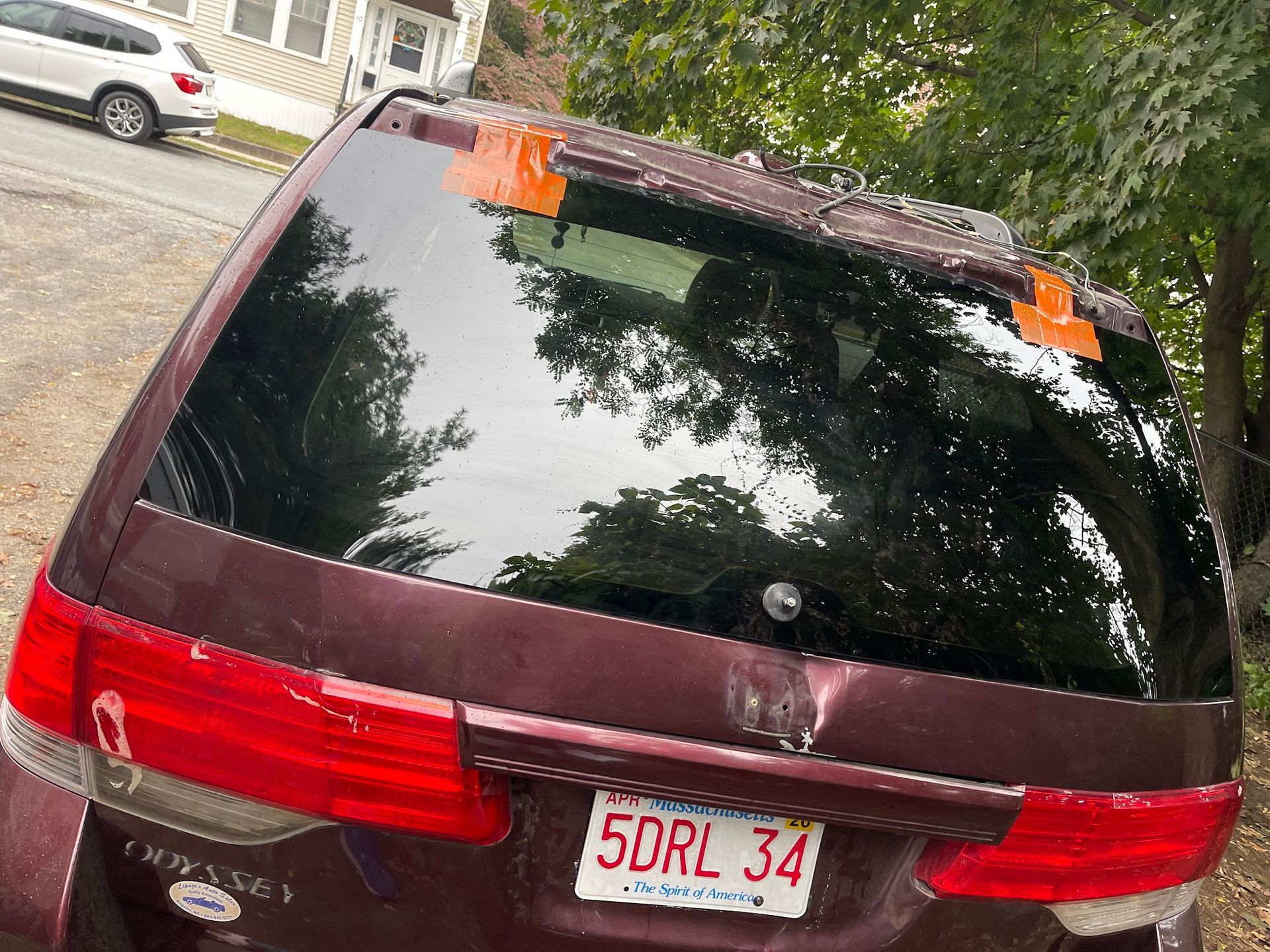 A purple car with a license plate that says 5drl 34