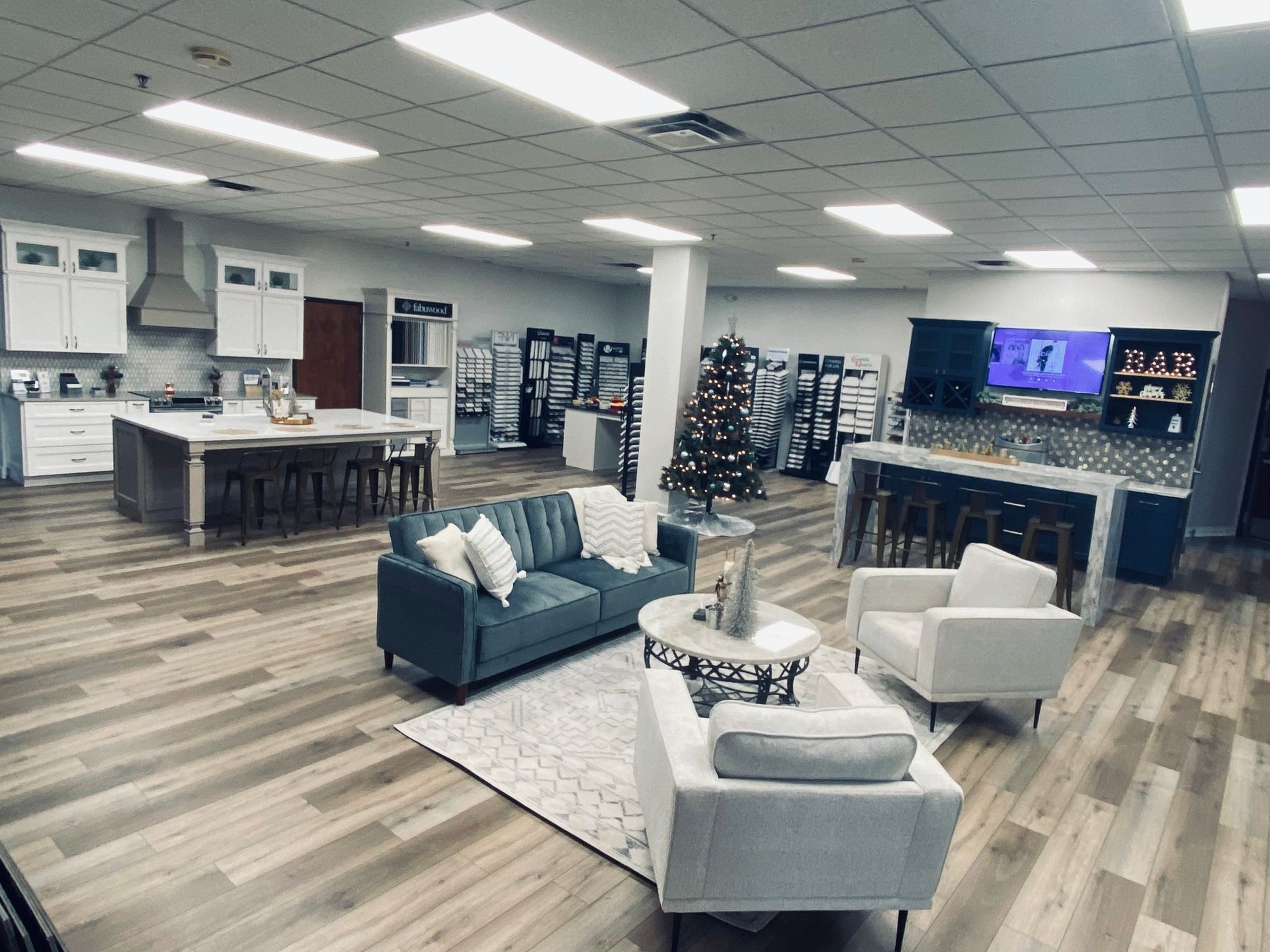 A living room filled with furniture and a christmas tree.