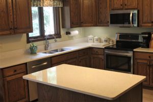 A kitchen with wooden cabinets , stainless steel appliances , and a large island.