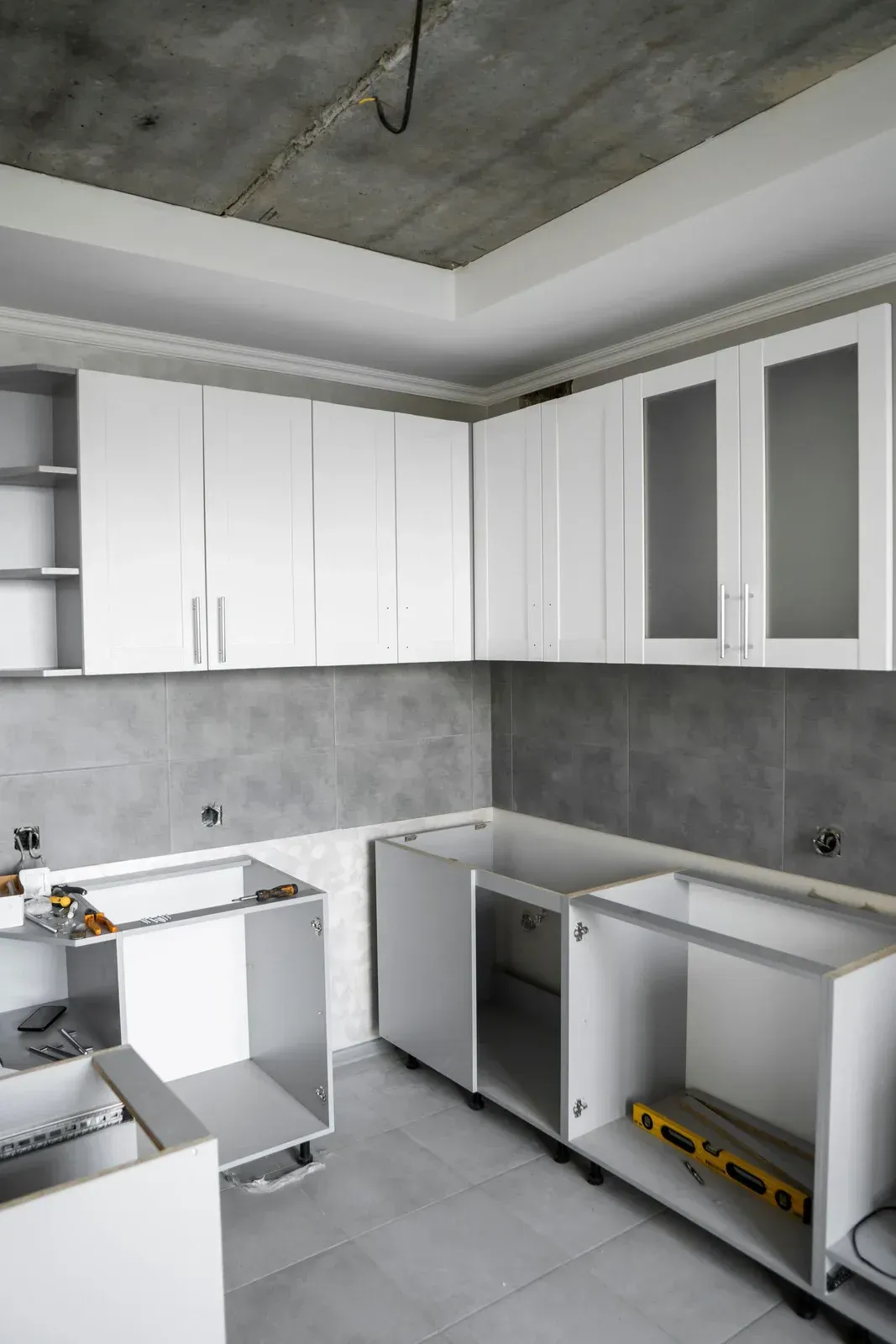 A kitchen with stainless steel appliances and wooden cabinets