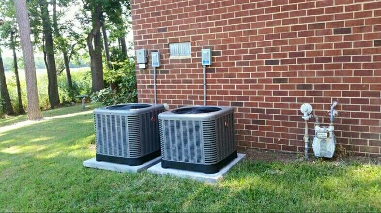 Worker Installing Split Type Aircon - Lexington, NC - Bailey Oil Co. Inc.