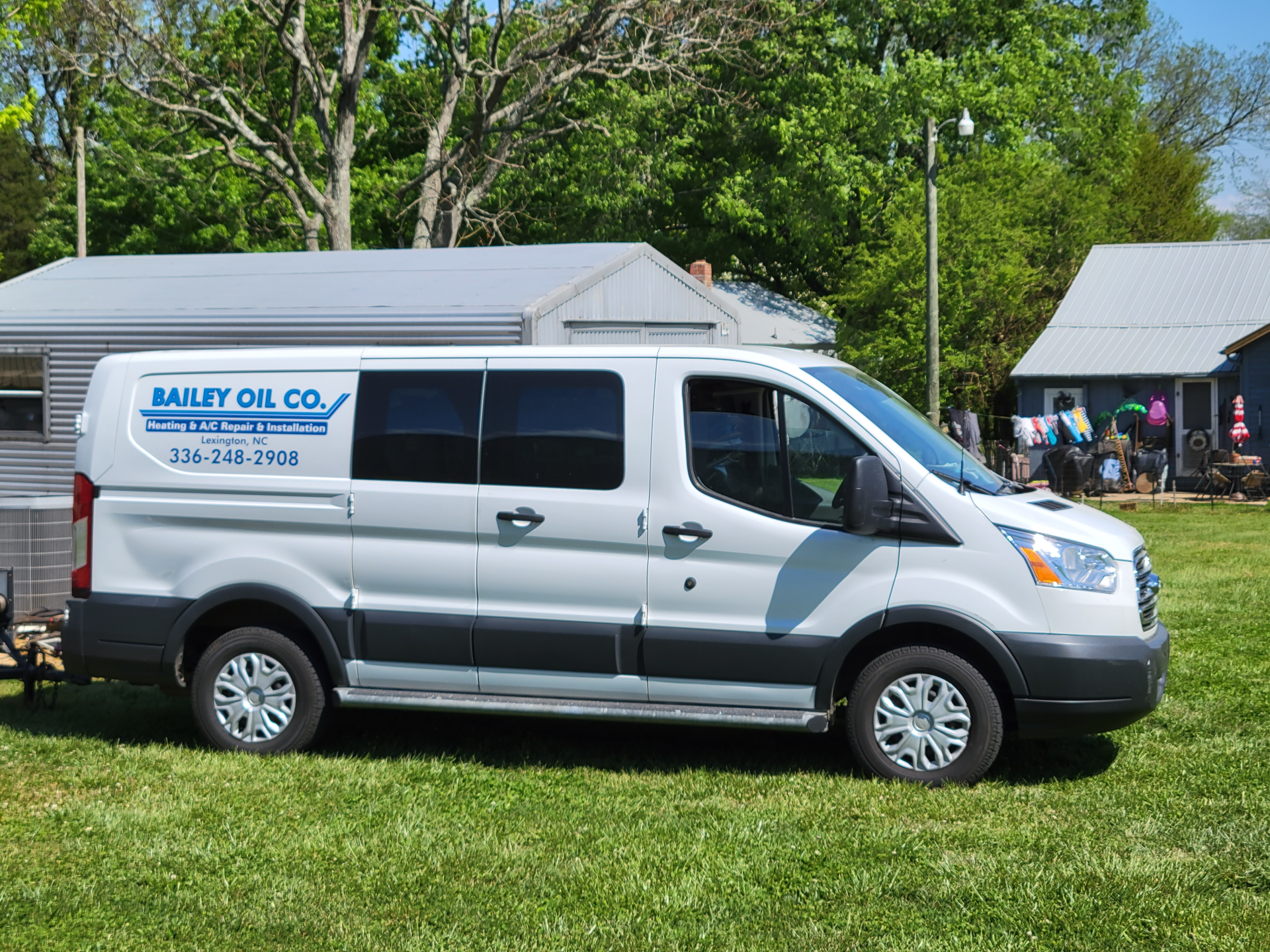 Worker Fixing The Air Conditioner Unit Outdoor - Lexington, NC - Bailey Oil Co. Inc.