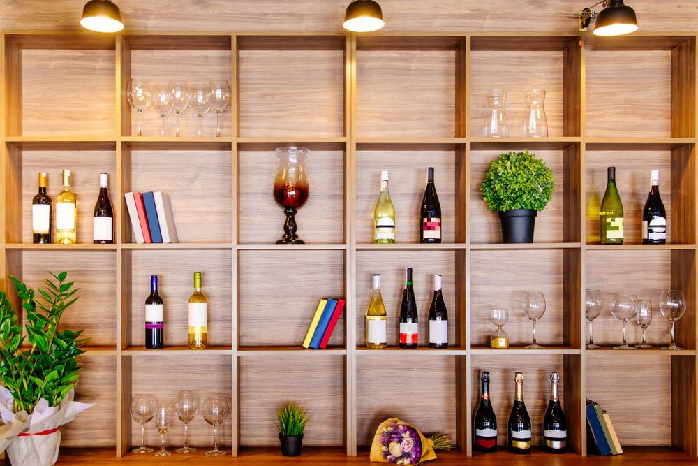 Wooden Shelving Unit Displaying Wine Bottles — BYO Cellars in Hawks Nest, NSW