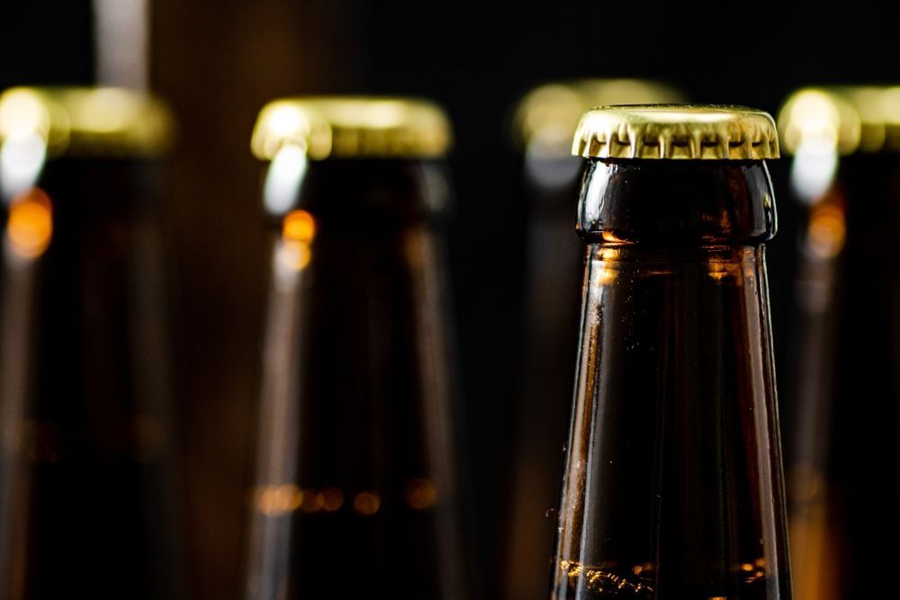Brown Beer Bottles With Golden Bottle Caps — BYO Cellars in Coffs Harbour, NSW