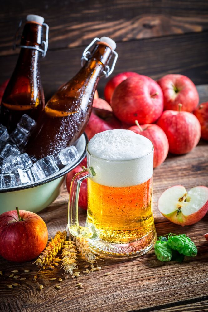 Beer Mug With Foam, Brown Bottles in Ice Bucket, Red Apples on Wooden Surface — BYO Cellars in Anna Bay, NSW