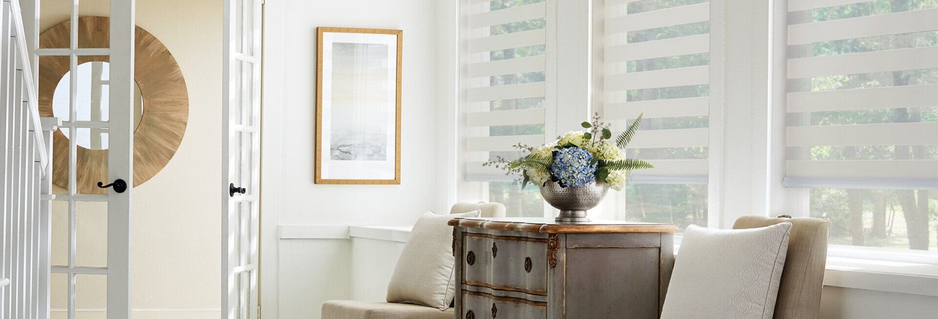 There is a vase of flowers on the table in the living room.