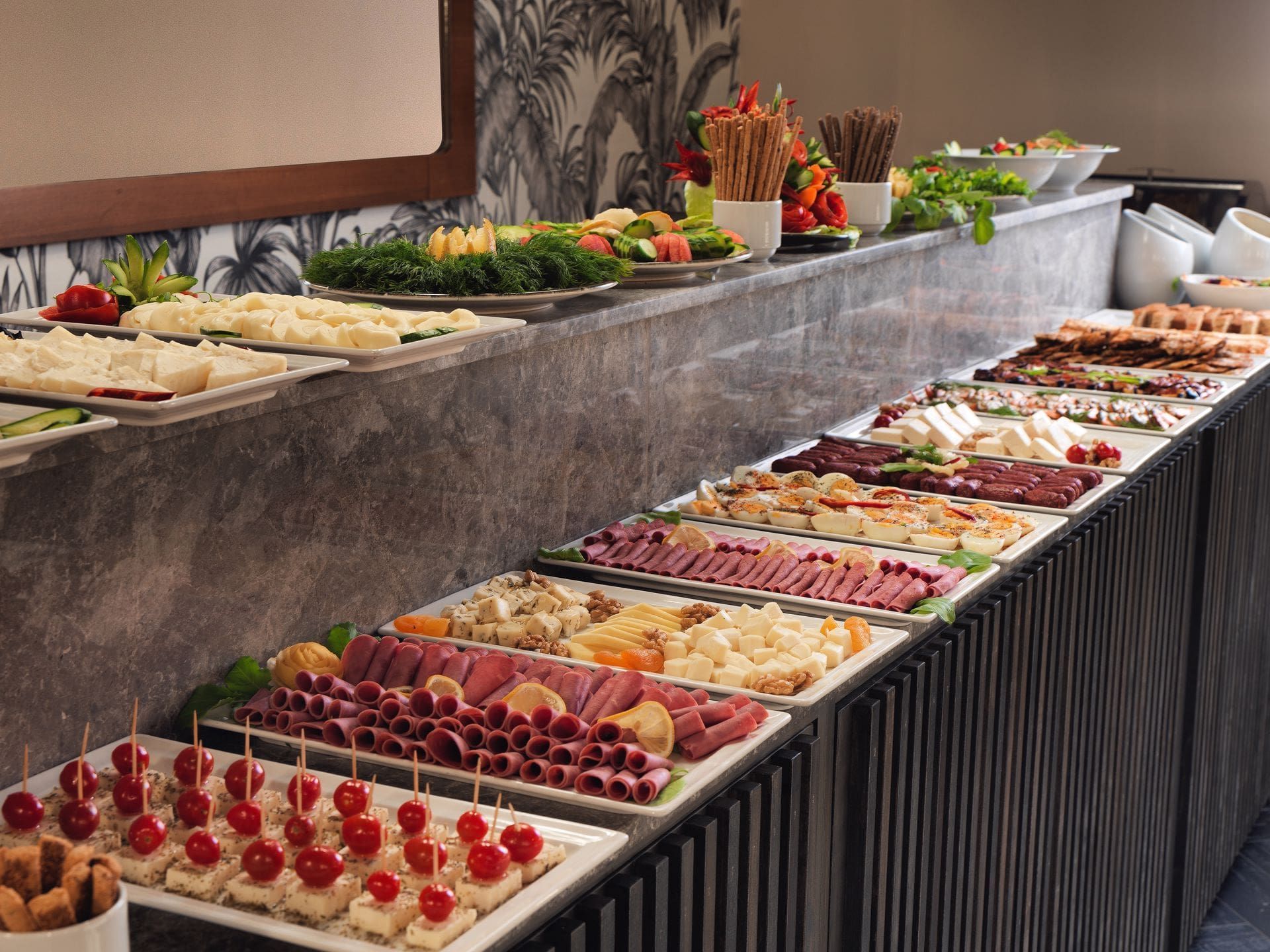 A buffet table with a variety of food on it
