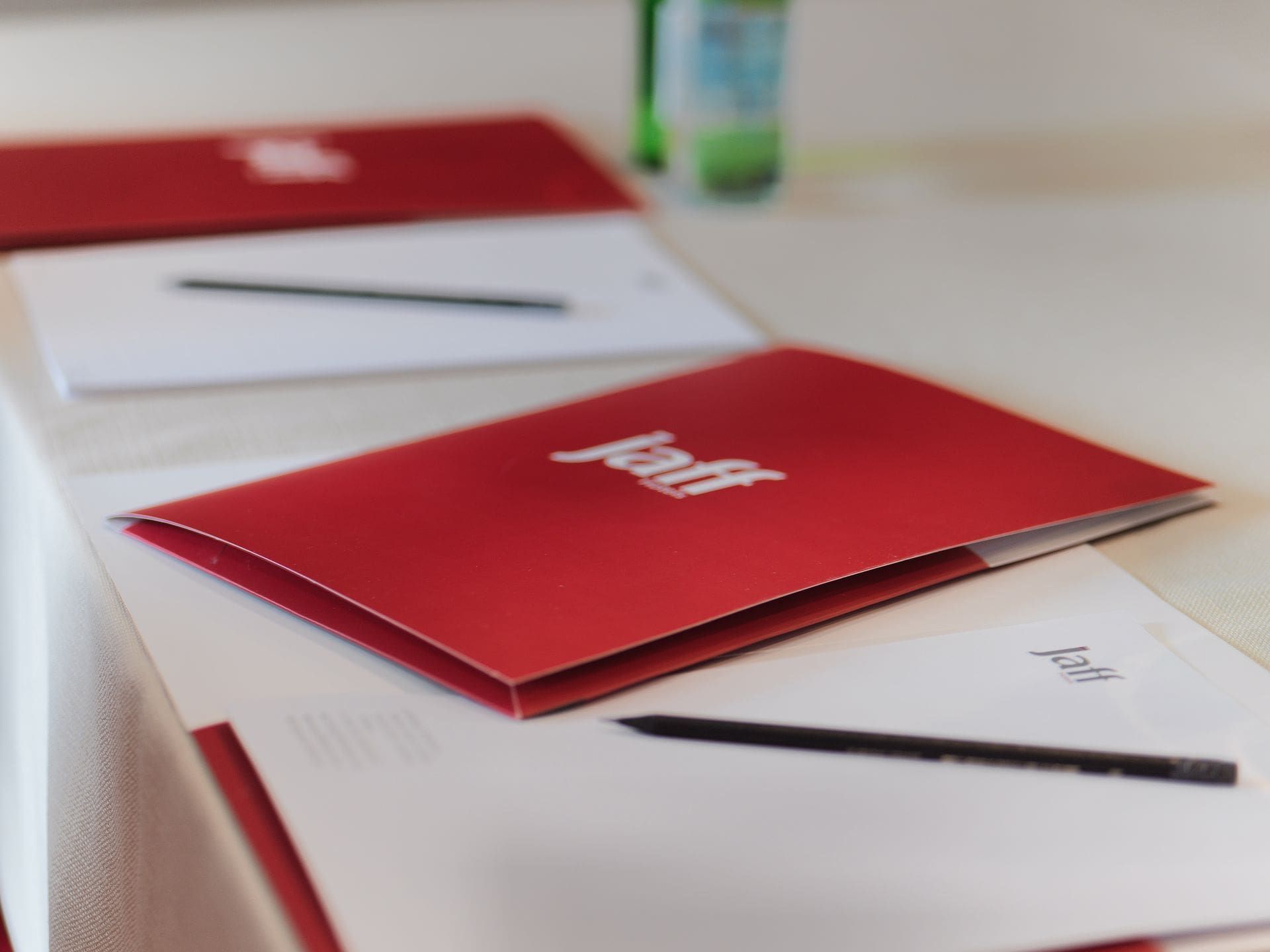 A red folder with the word jeff on it