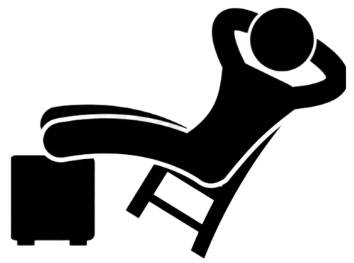 Person reclining in chair with feet on a footstool, arms behind head.