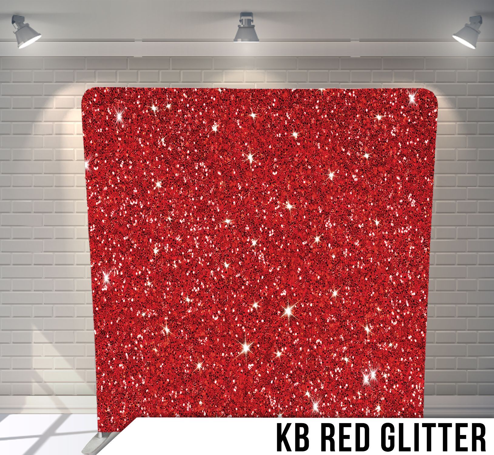 Red glitter backdrop in front of a white brick wall, lit by overhead spotlights.