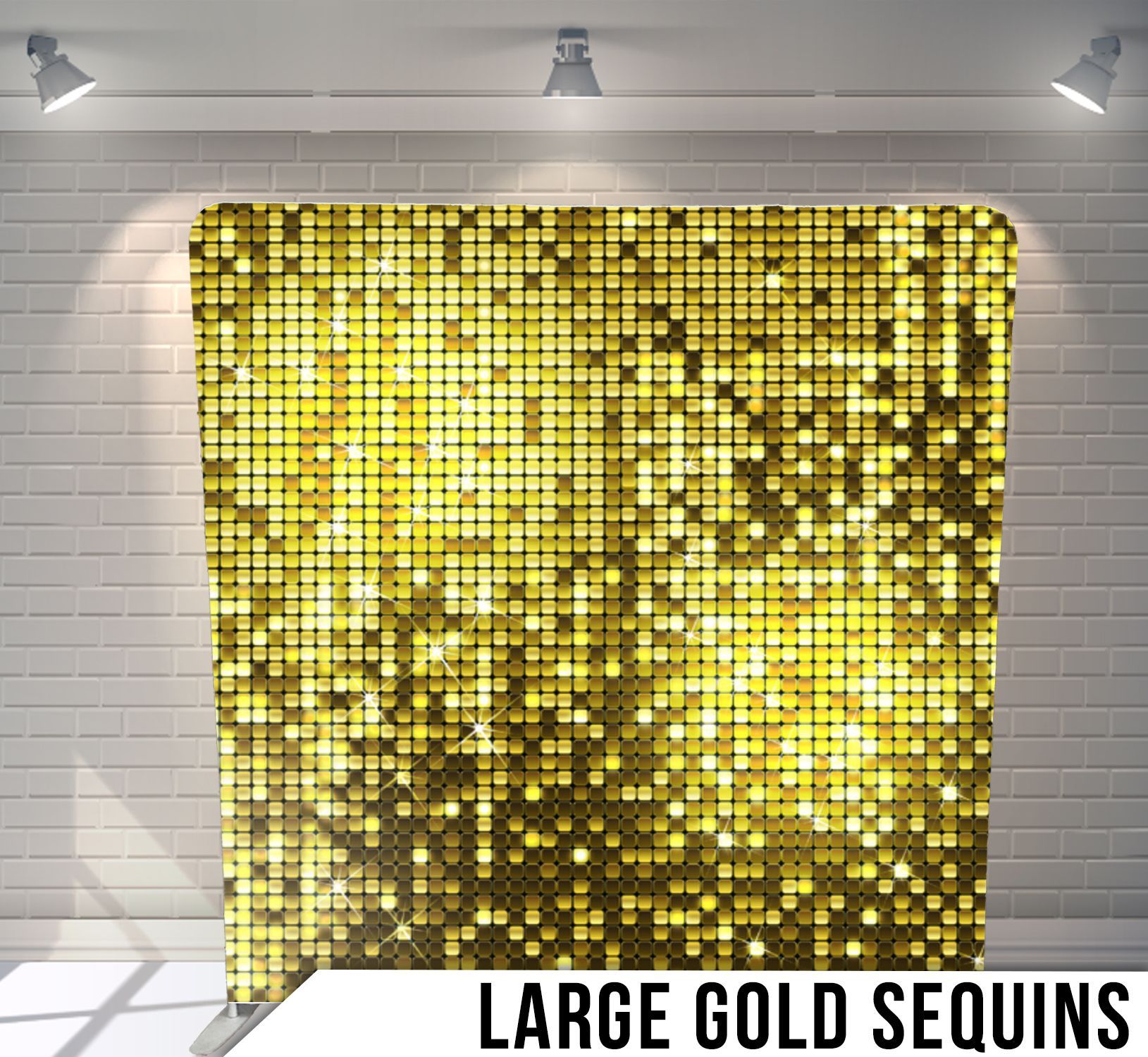 Gold sequin backdrop for a photo booth. White brick wall with spotlights.