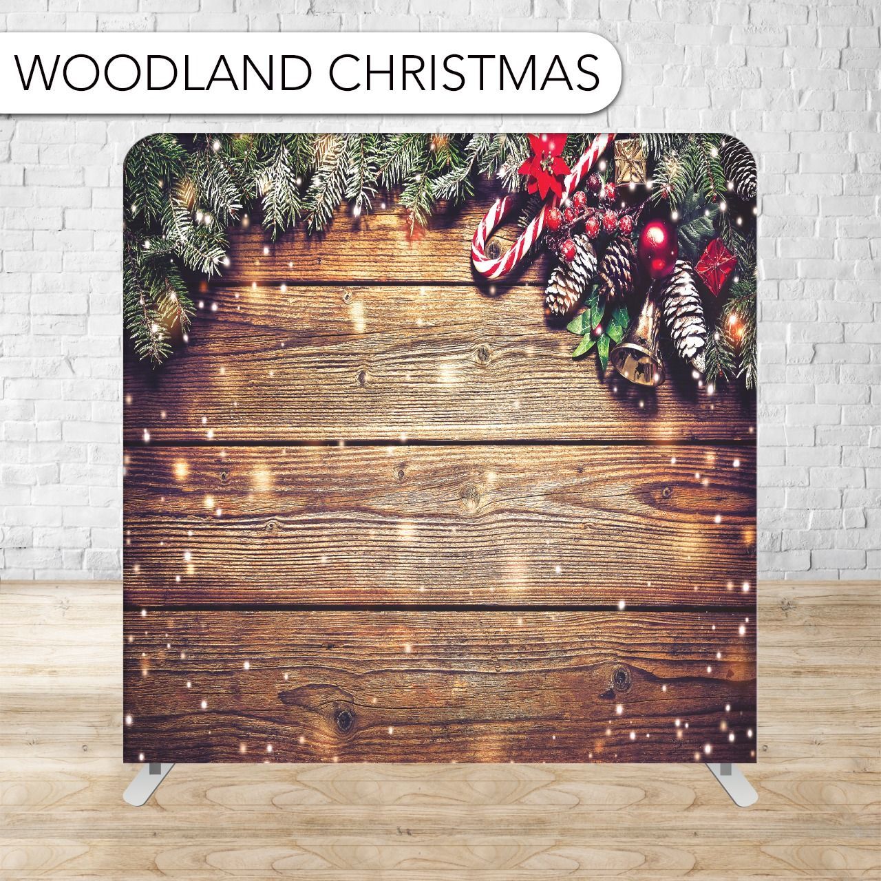 Woodland Christmas backdrop with snow, candy cane, pine cones and garland on a rustic wooden background.