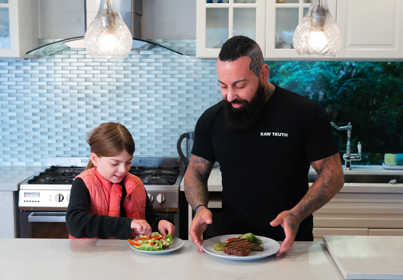 Father and child preparing a simple, healthy meal at home as part of a sustainable weight loss lifestyle