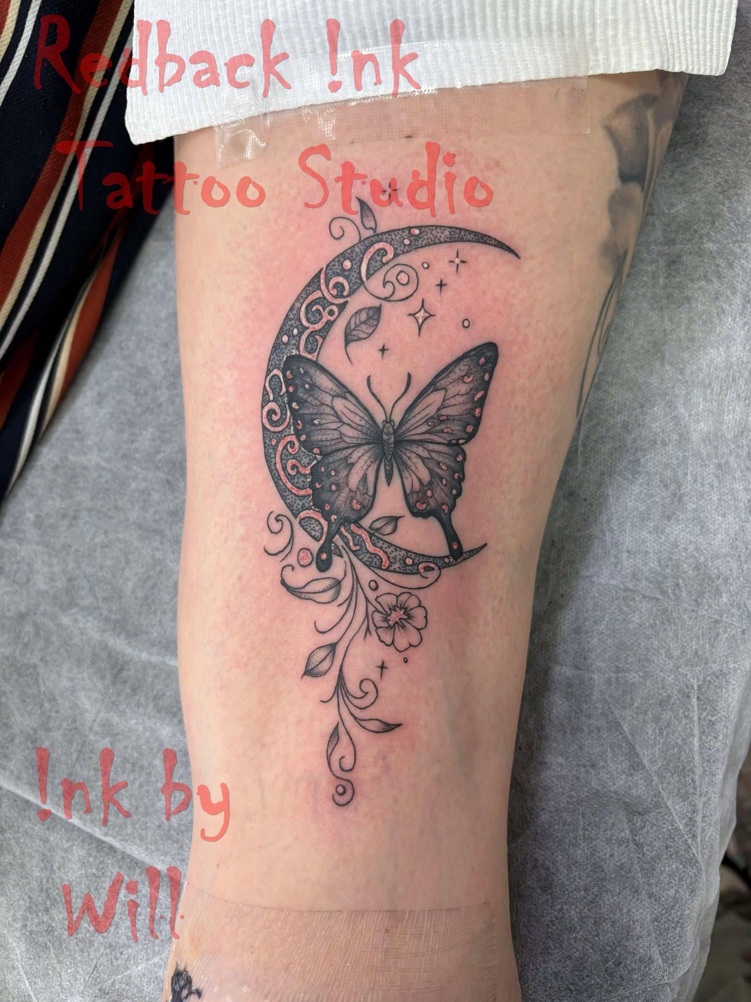Butterfly on a Crescent Moon Tattoo in Black Ink on the Forearm — Redback !nk Tattoo Studio in Kawana, QLD
