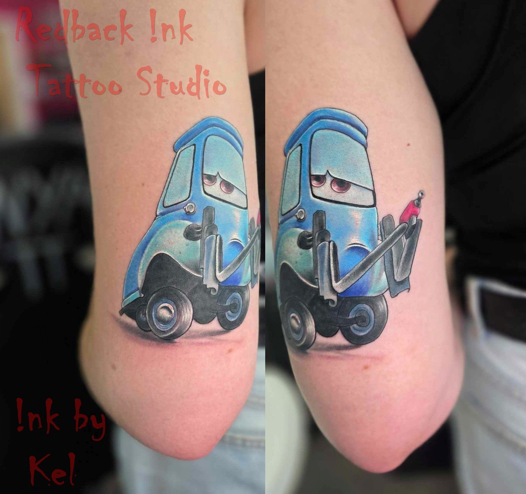 A tattoo of a blue Cars movie character, with a sad expression, is on a person's arm.