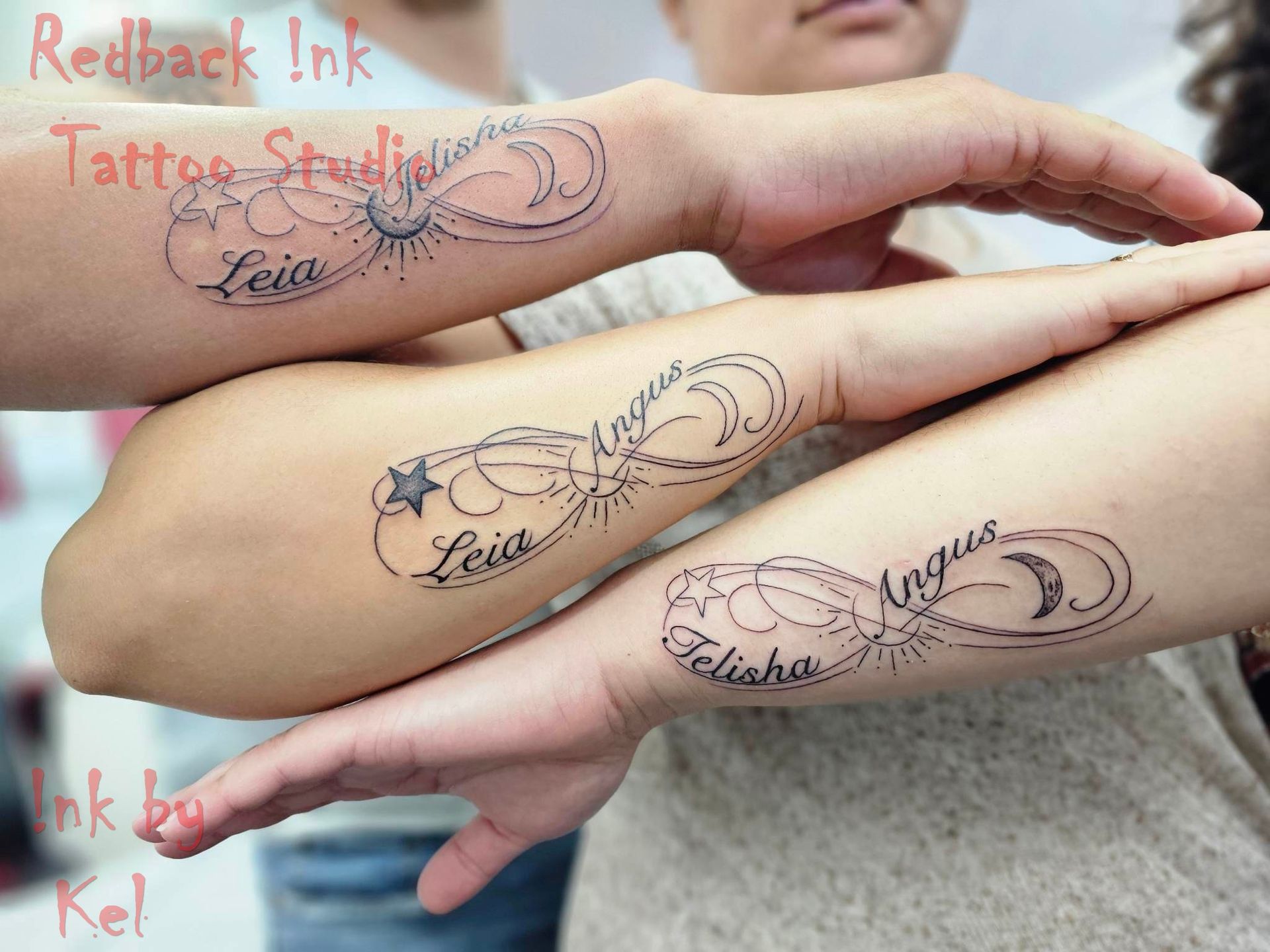 Three arms with matching infinity tattoos, each with a name and celestial symbol.