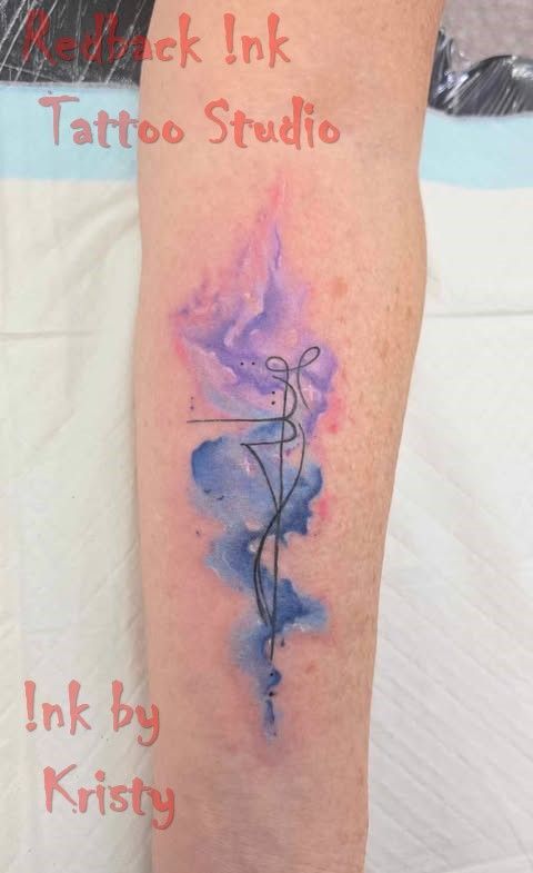 Watercolor tattoo on a leg: purple and blue abstract background with a thin black line drawing — Redback !nk Tattoo Studio in Kawana, QLD