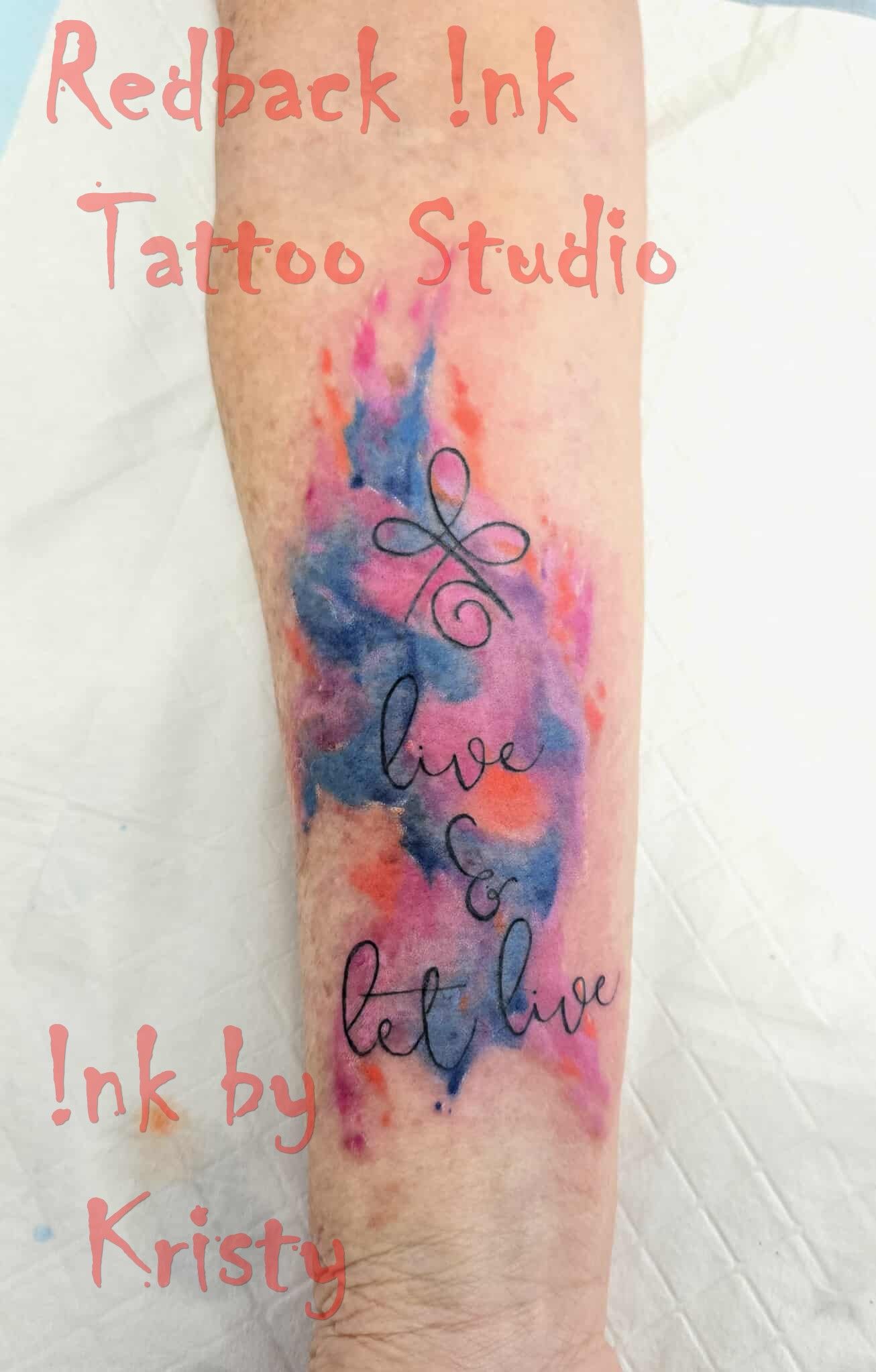 Tattoo on arm: colorful watercolor with 