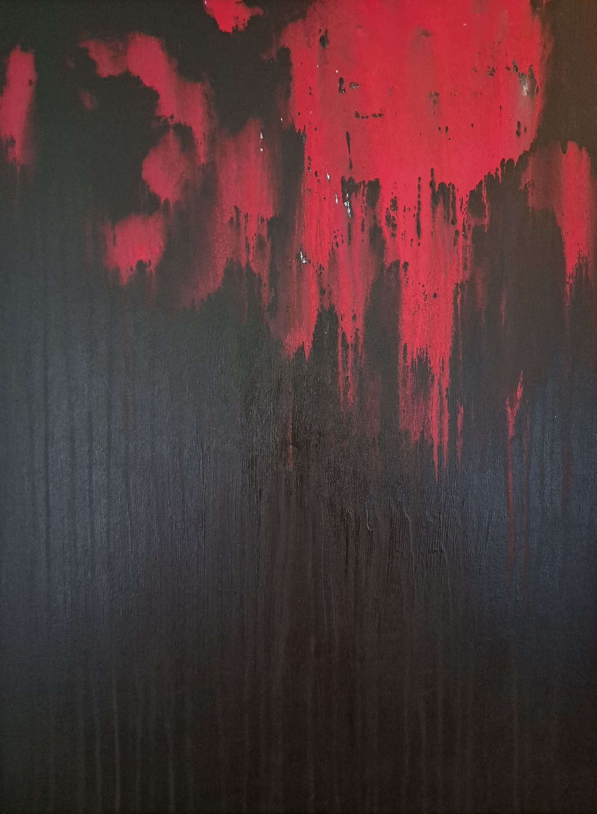 A close up of a black and red painting.