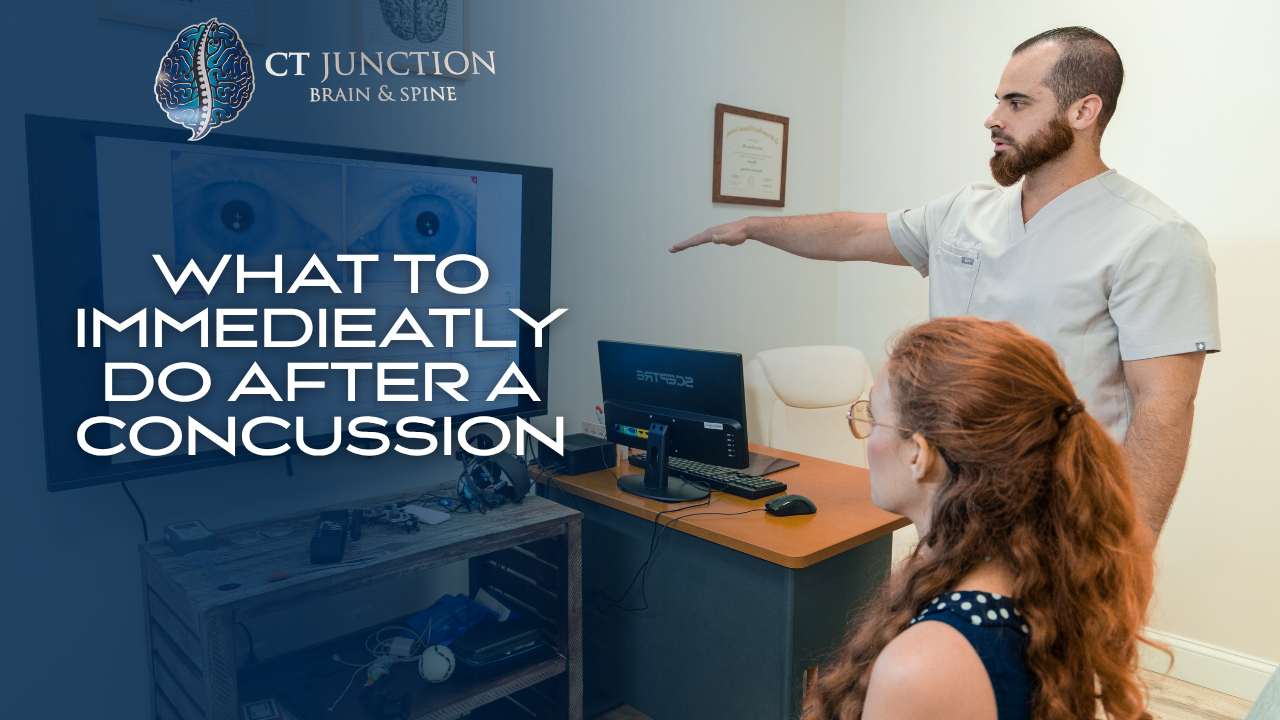 A healthcare professional gestures toward a screen displaying 