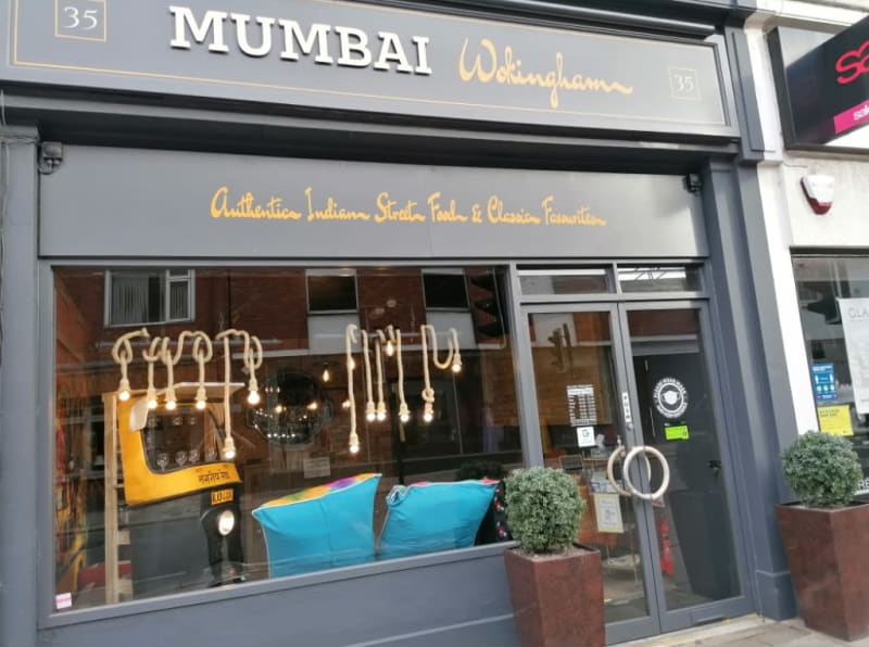 A store front with the name mumbai written on it