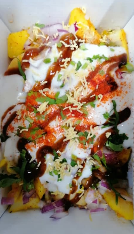 A close up of a plate of food with a lot of toppings