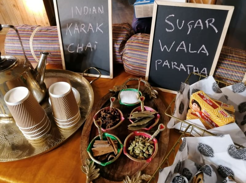 A table with a sign that says sugar wala paratha