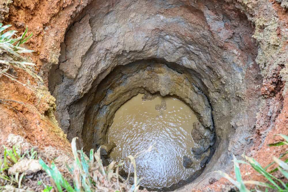 A Hole in the Ground Filled With Mud and Water — Kowaltzke Drilling Services in Gatton, QLD 