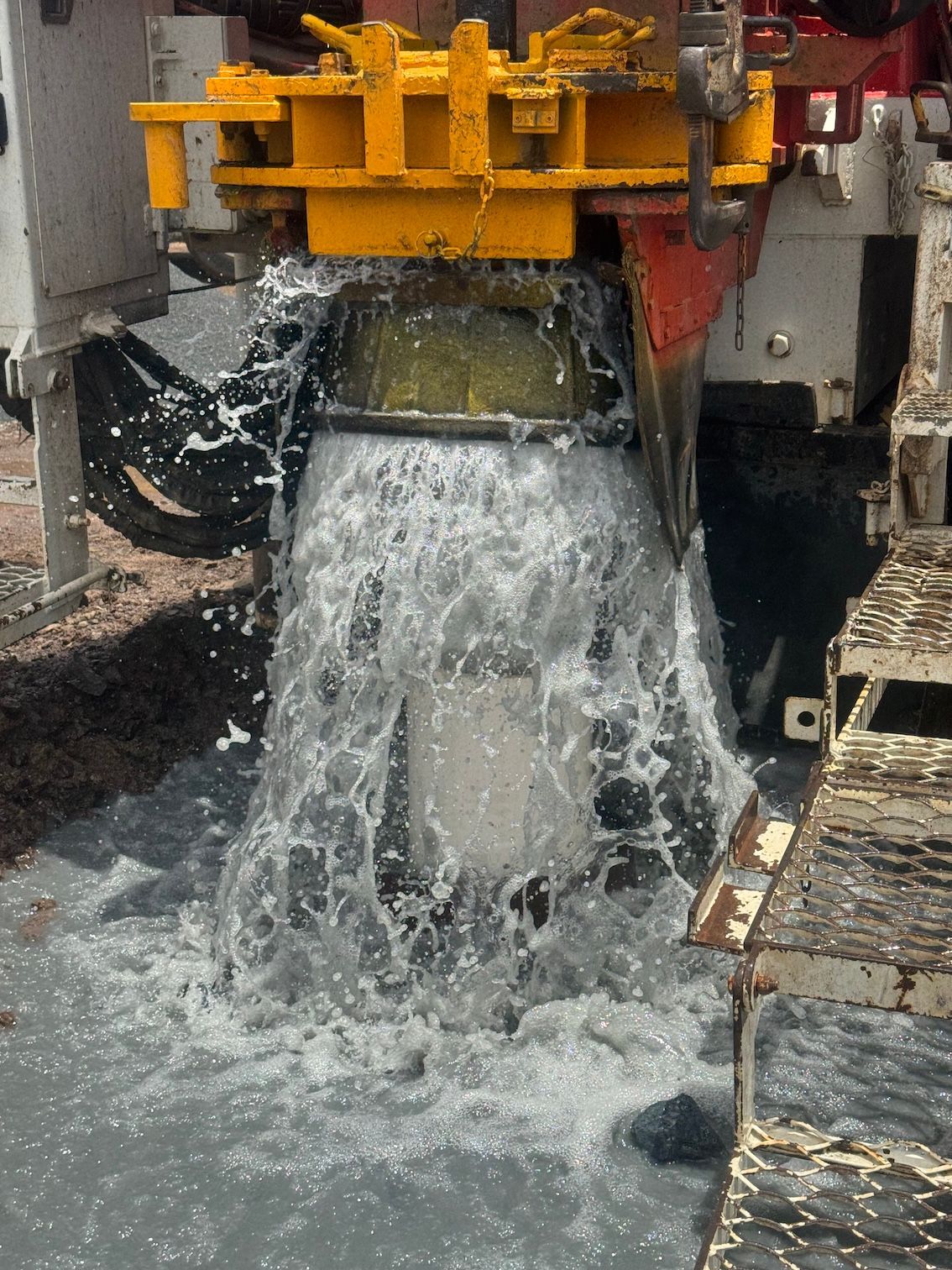 Water Gushing Into Drilling Machine — Kowaltzke Drilling Services in Gatton, QLD 