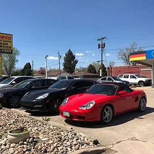 Row of cars parked outside | AutoImports of Denver