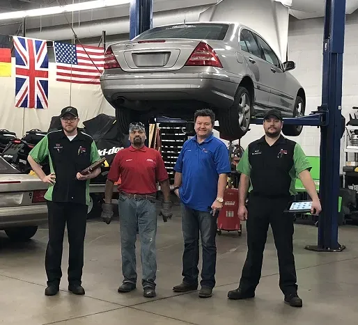 Staff inside of our garage ready for auto repair | AutoImports of Denver