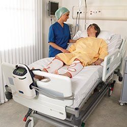 Nurse standing bedside of patient wearing MedVantage DVT's