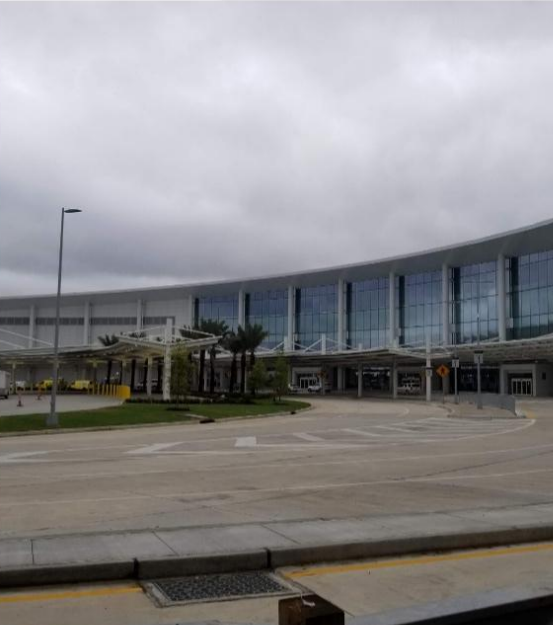 A large building with a lot of windows on a cloudy day