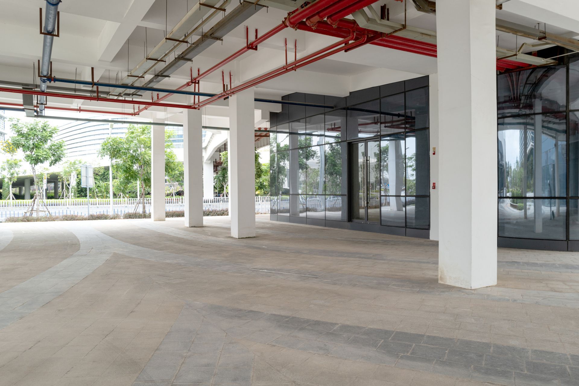 Fire extinguishing water pipe on ceiling of concrete building.