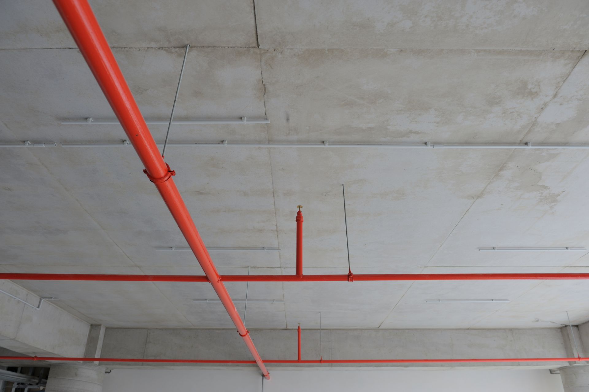 Fire security and sprinkler system installation in progress for a commercial property.