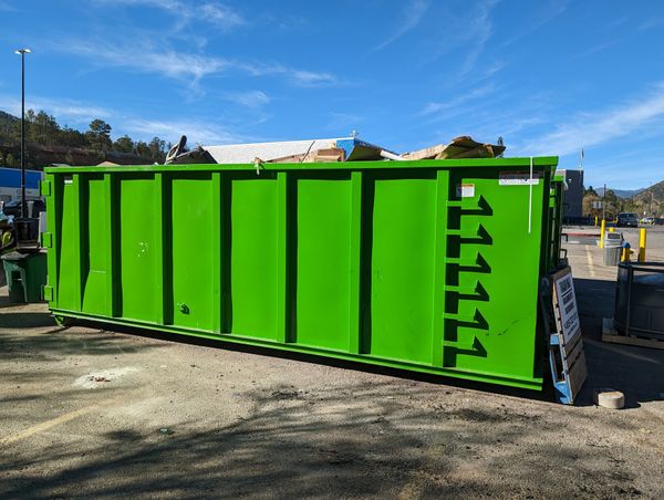 a big green 40 yard dumpster