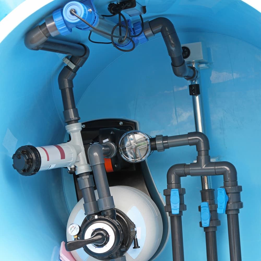 Blue pool equipment: pump, filter, and pipes inside a blue enclosure. — Intouch Pools & Spas in Forster, NSW