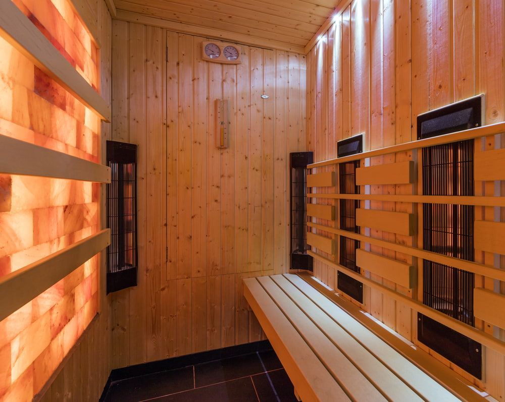 Inside a Wood-panelled Infrared Sauna With a Bench — Intouch Pools & Spas in Tuncurry, NSW