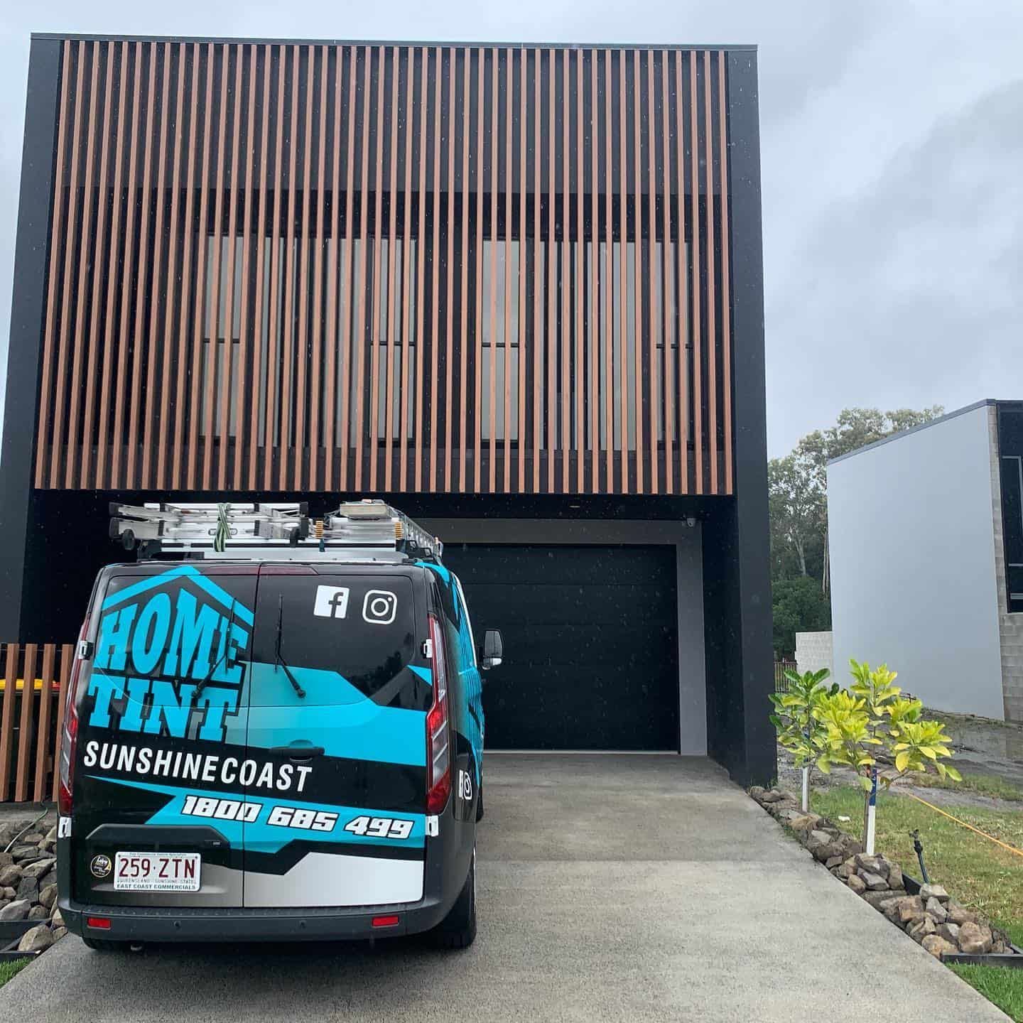 A Home Tint Van Is Parked In Front Of A House — Home Tint Sunshine Coast Window Tinting In Maroochydore, QLD