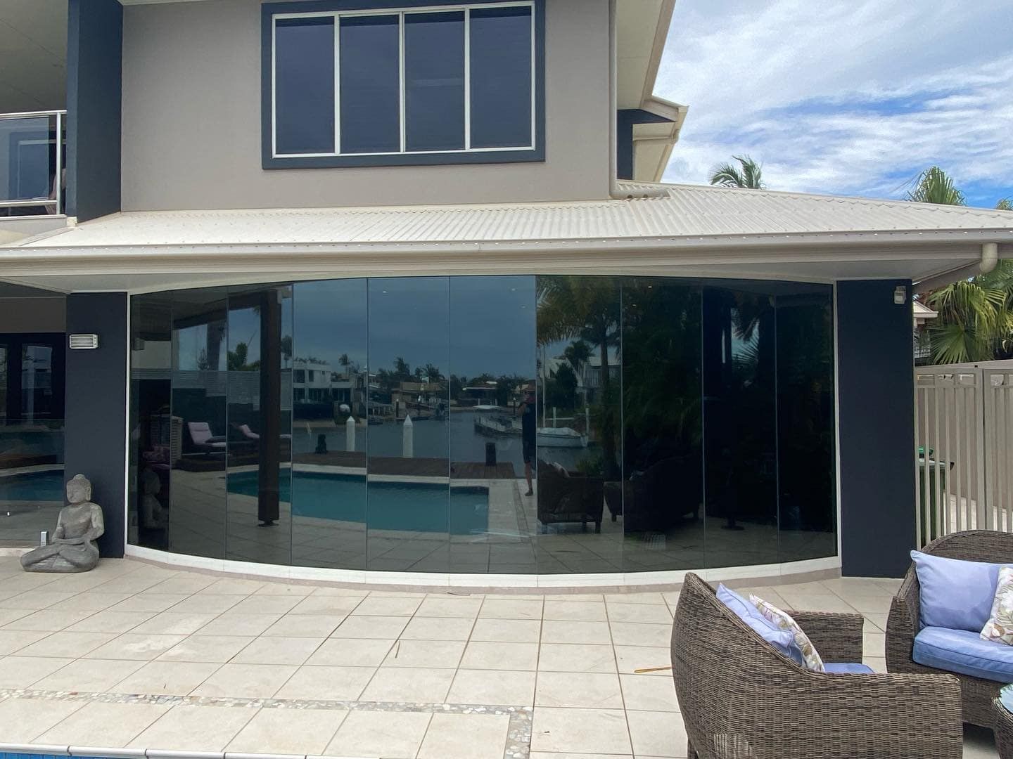 A Large House With A Swimming Pool In Front Of It — Home Tint Sunshine Coast Window Tinting In Maroochydore, QLD