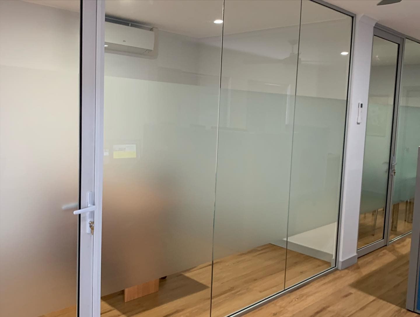 A Room With A Lot Of Glass Doors And A Wooden Floor — Home Tint Sunshine Coast Window Tinting In Maroochydore, QLD